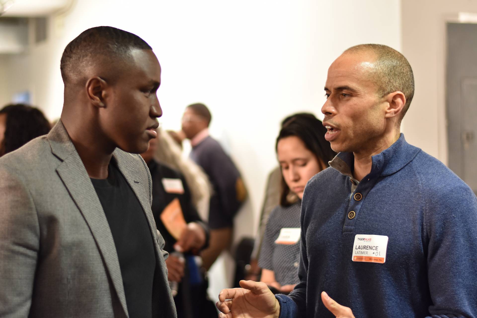 Two men have a conversation at the Tiger Talks conference