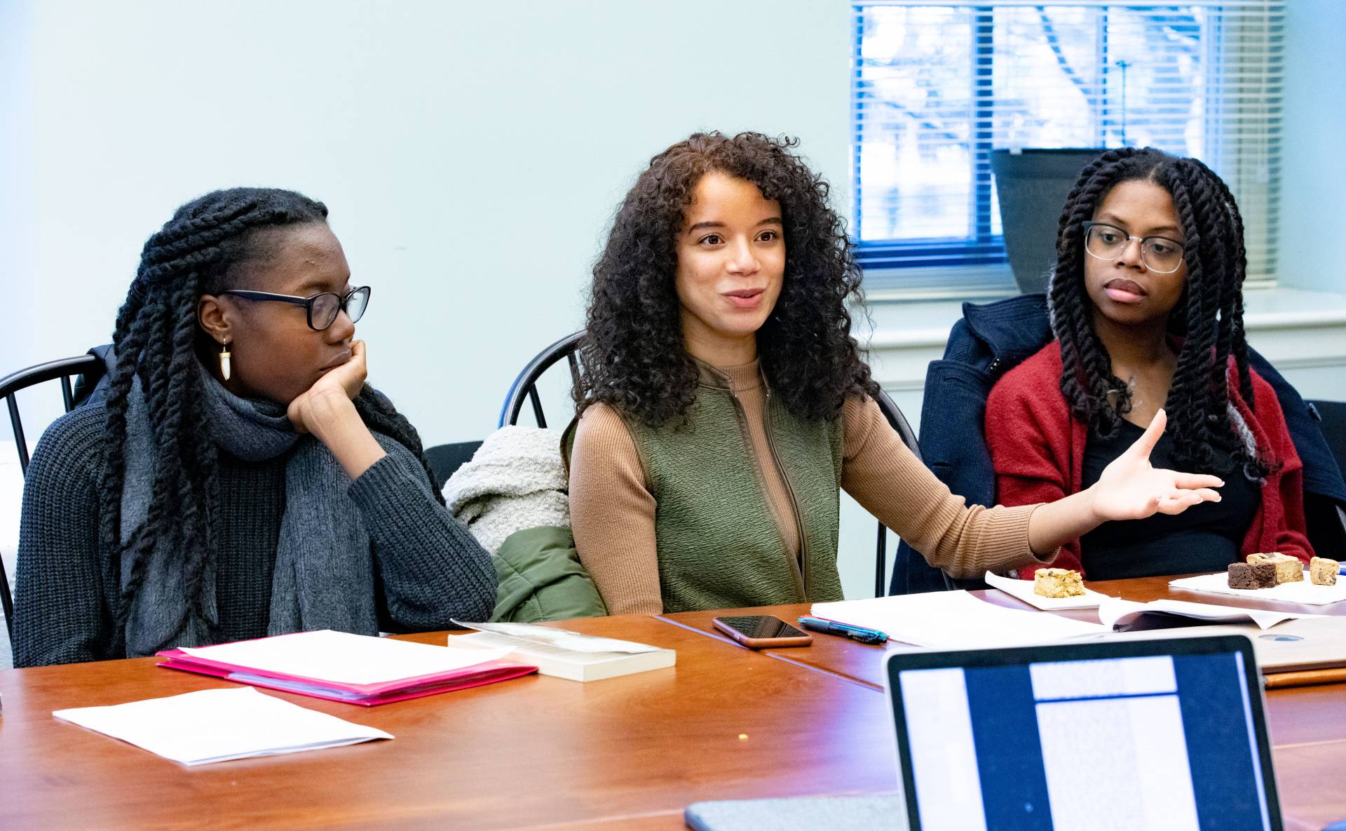 A graduate student adds to the class discussion