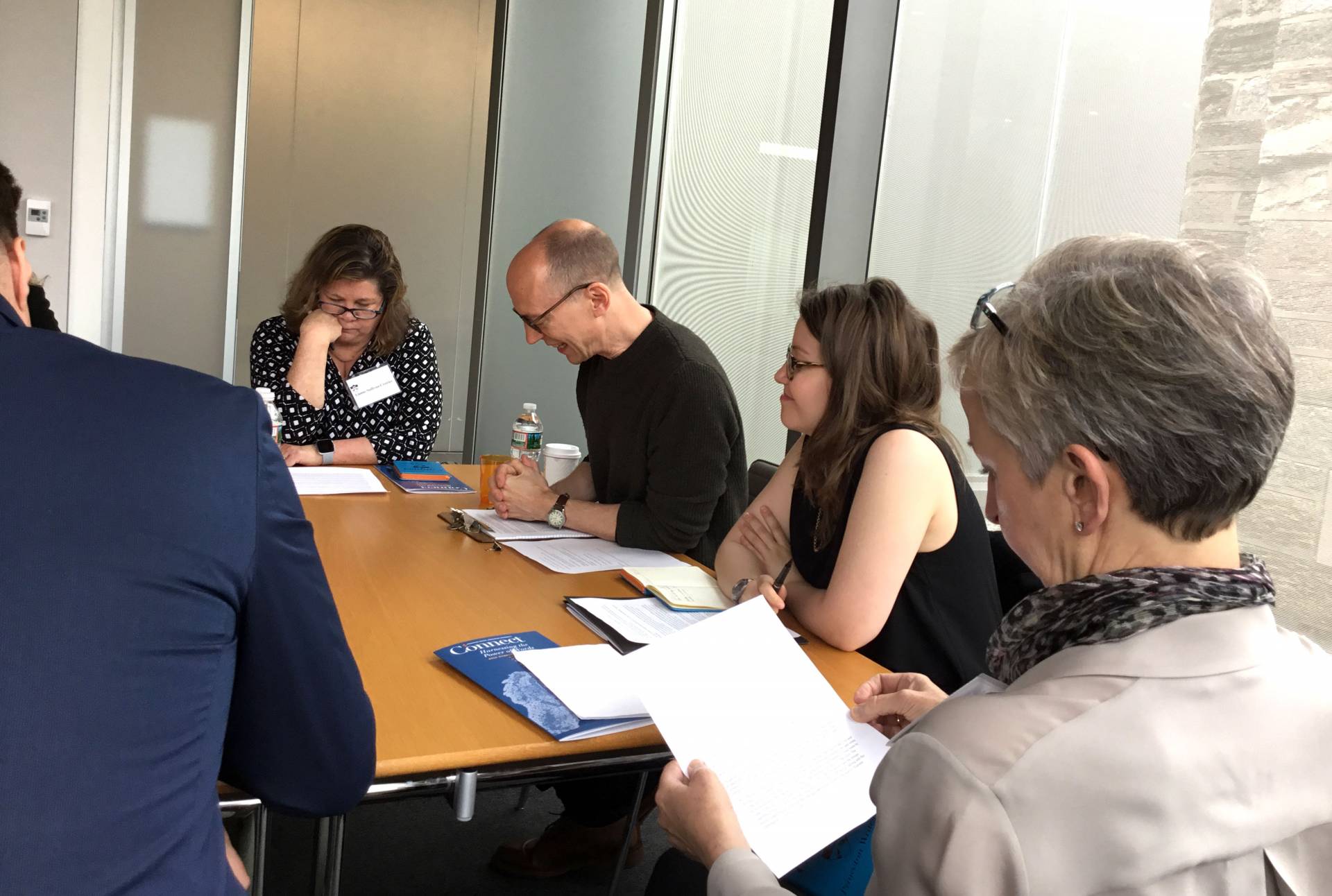People sitting around a table, working