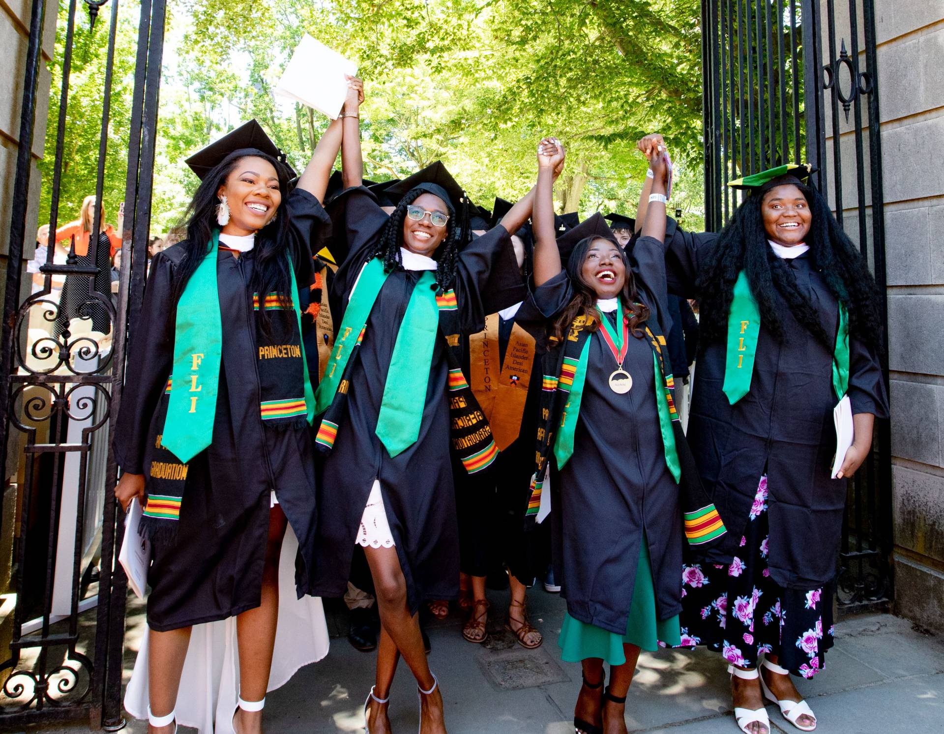 FLI students exiting the gate holding hands