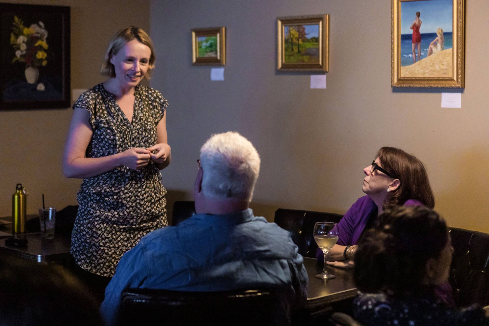 Jo Dunkley speaking with audience members at their table