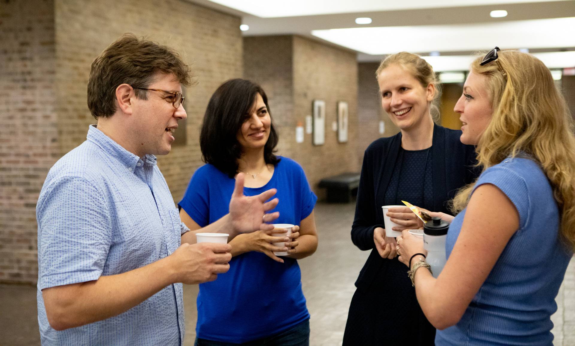 Matthew Salganik speaks informally to participants