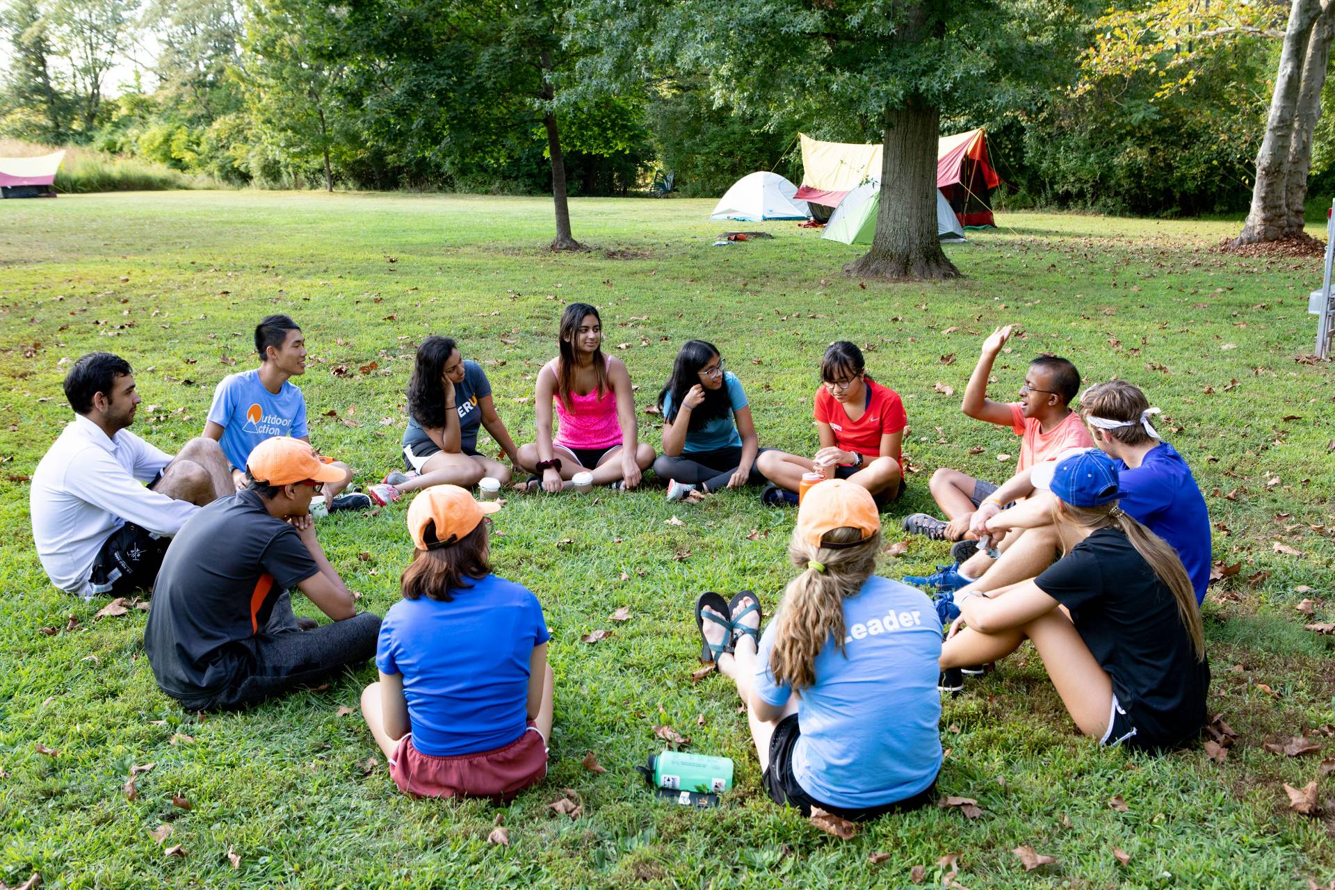 A group of students sit in a circle