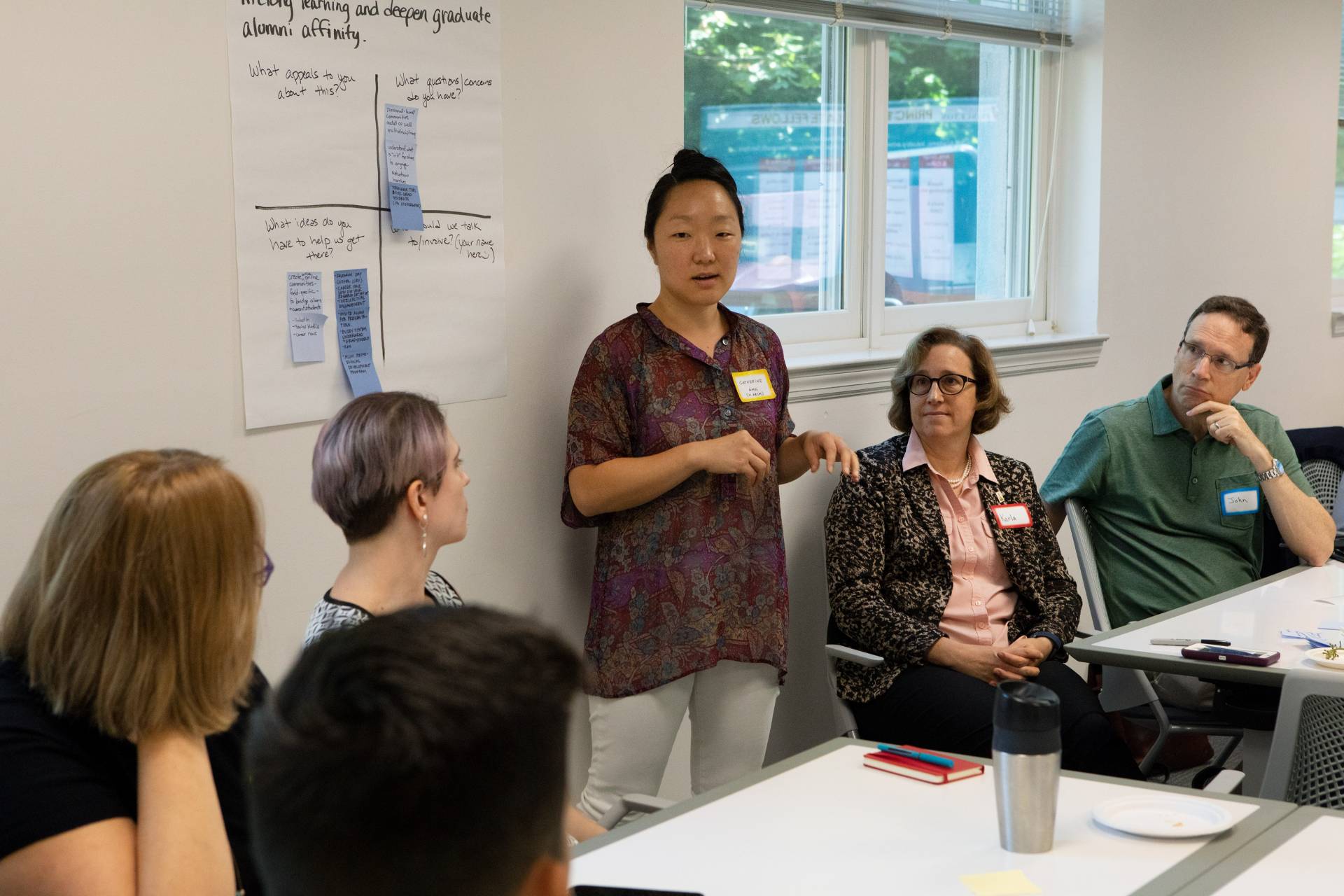 A students speaks in front of a group