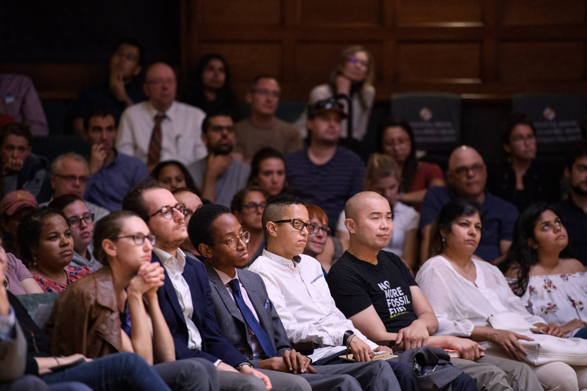 Audience members listening intently