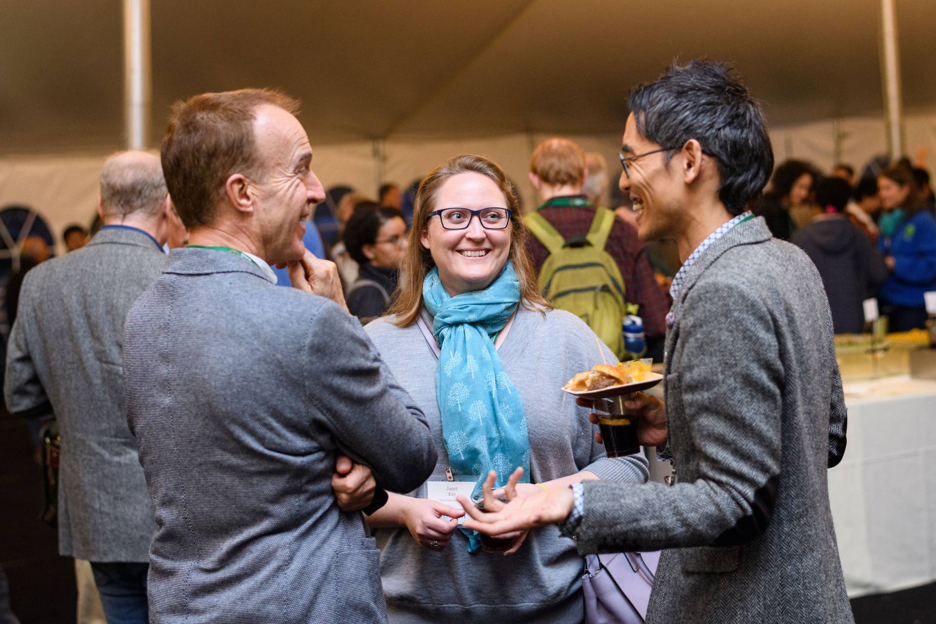 Rob Nixon, Janet Kay and Ryo Morimoto speaking with each other