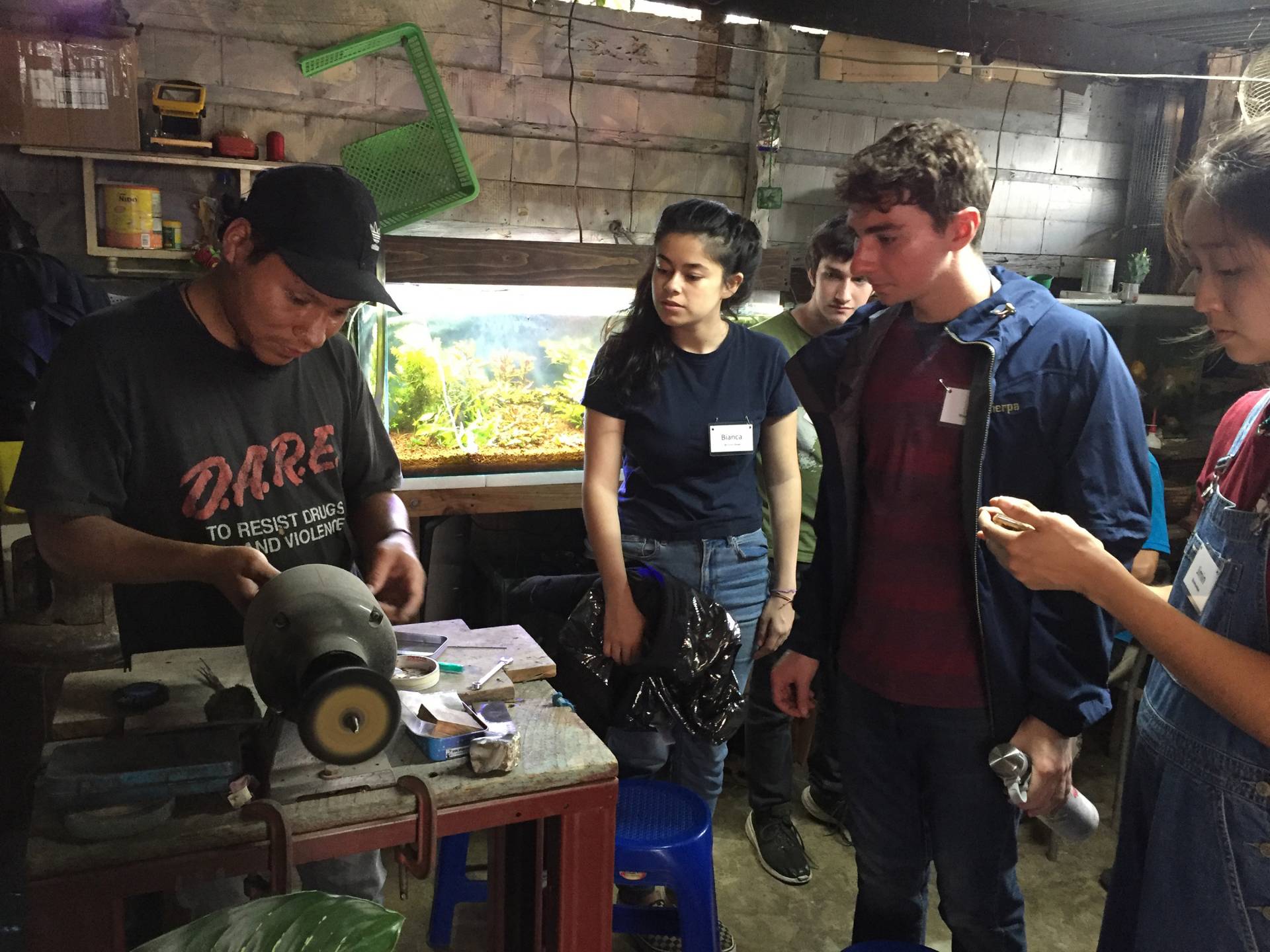 Students watch a silversmith at work