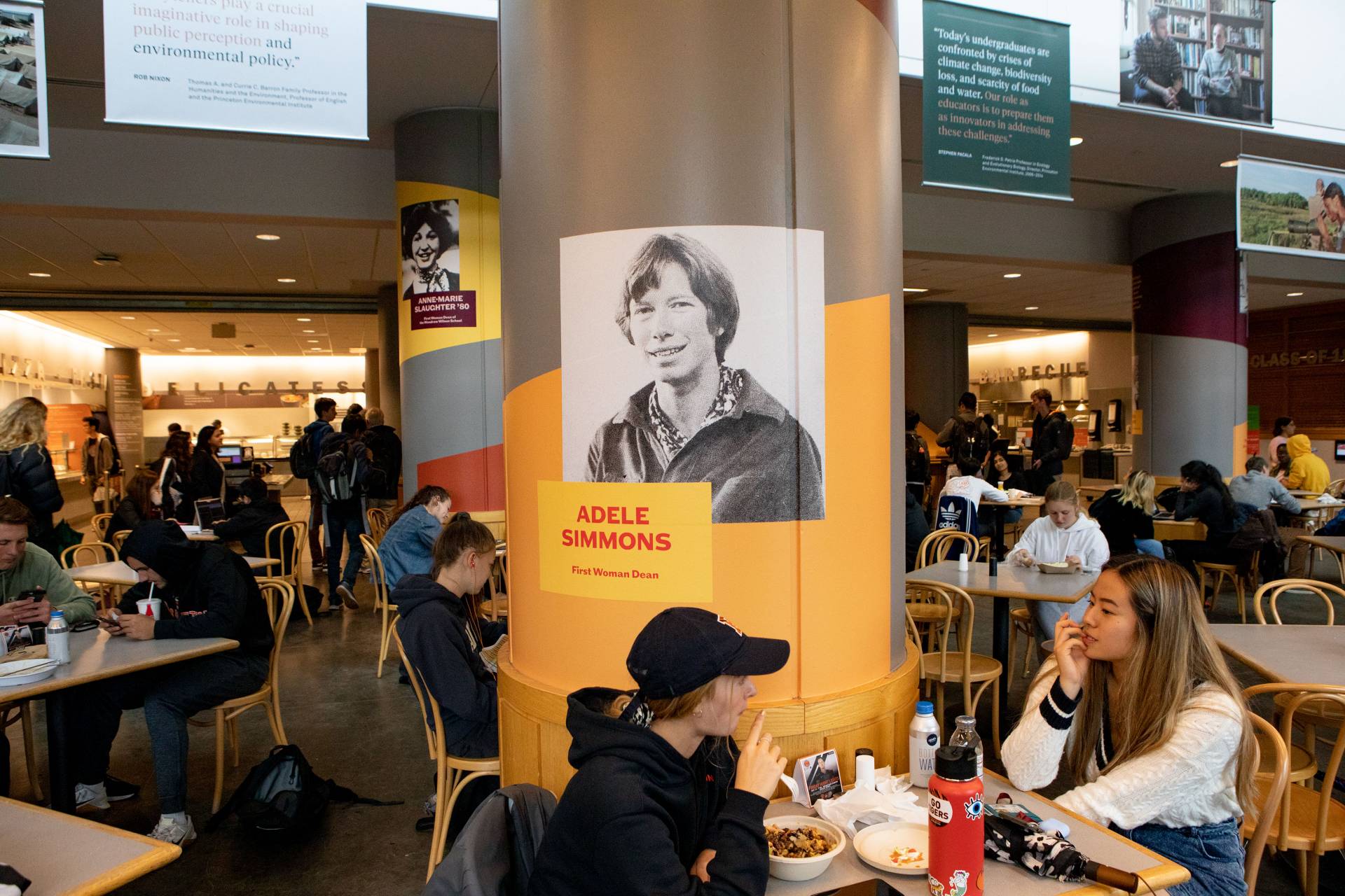 Students in front of an exhibit of archival photos and historical information at Frist
