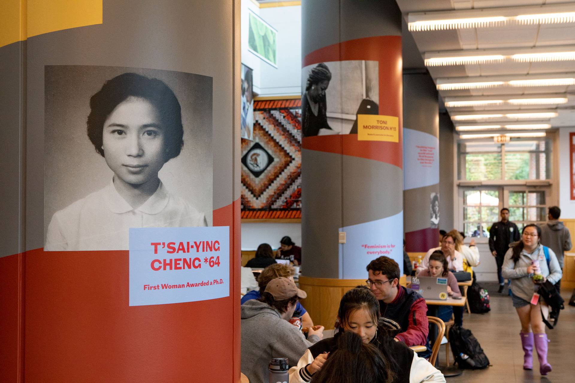 Students in front of an exhibit of archival photos and historical information at Frist