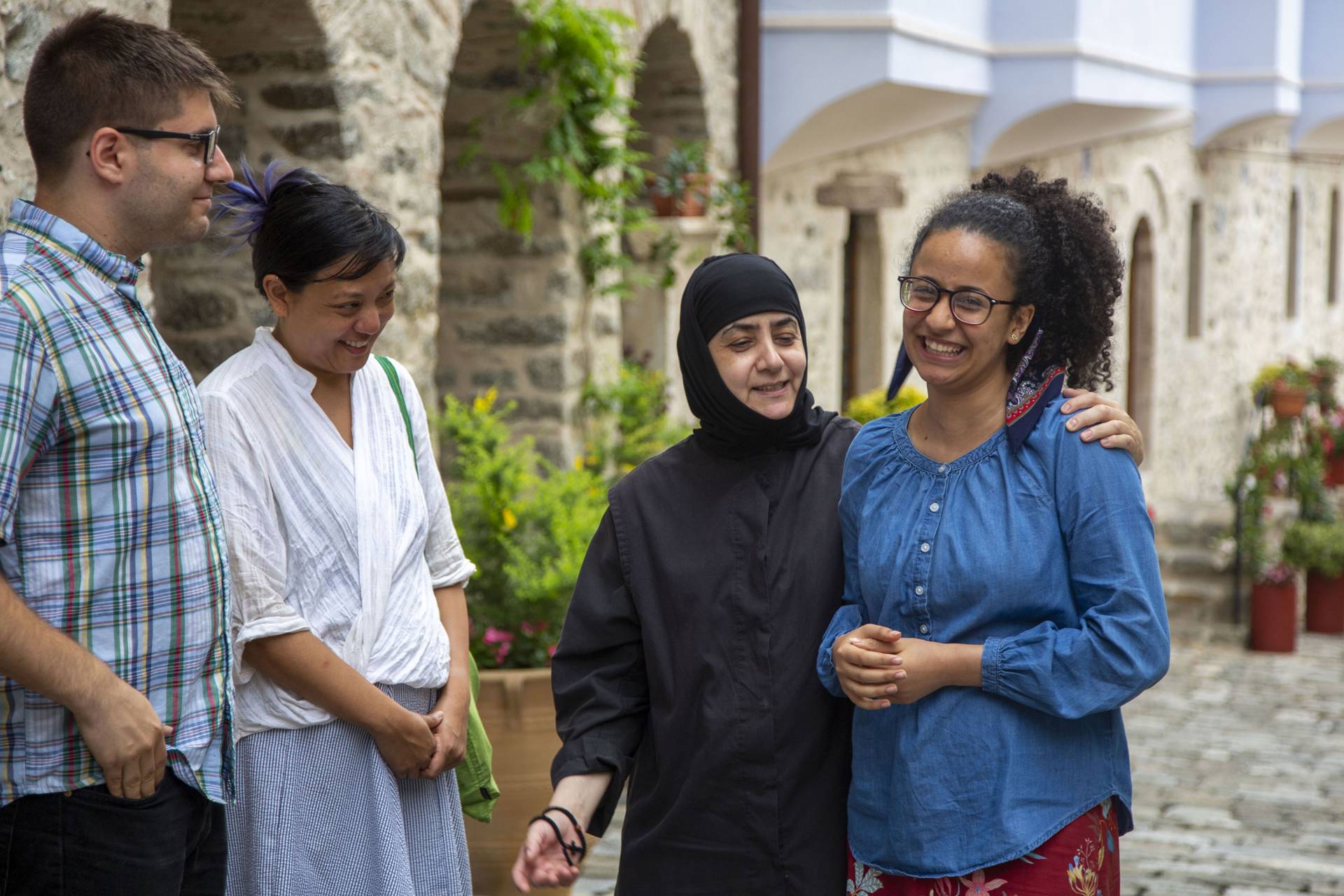 Students interact with a nun