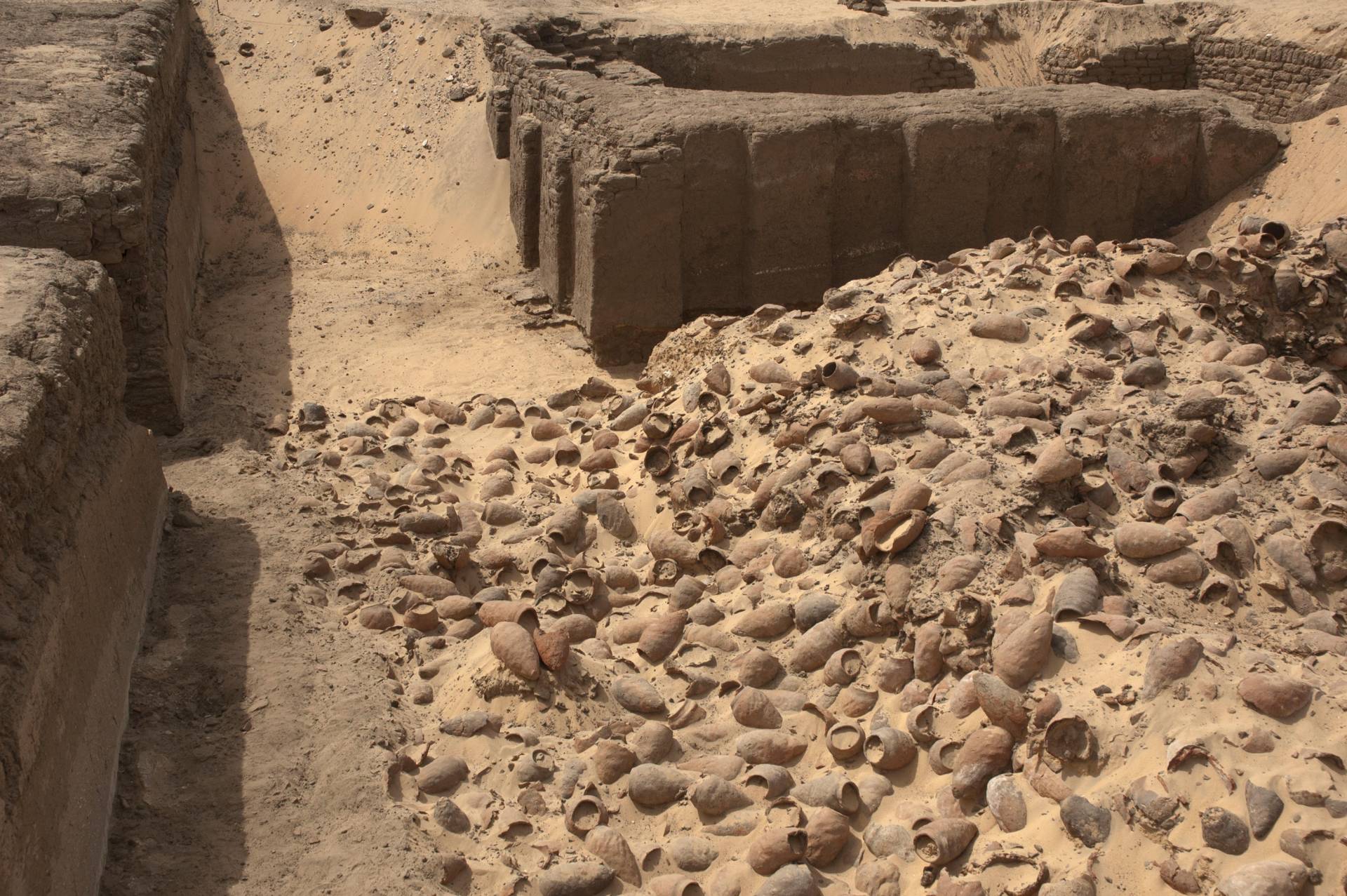 a large pile of earthenware jugs