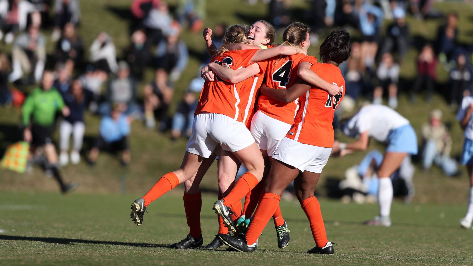athletes celebrate a win