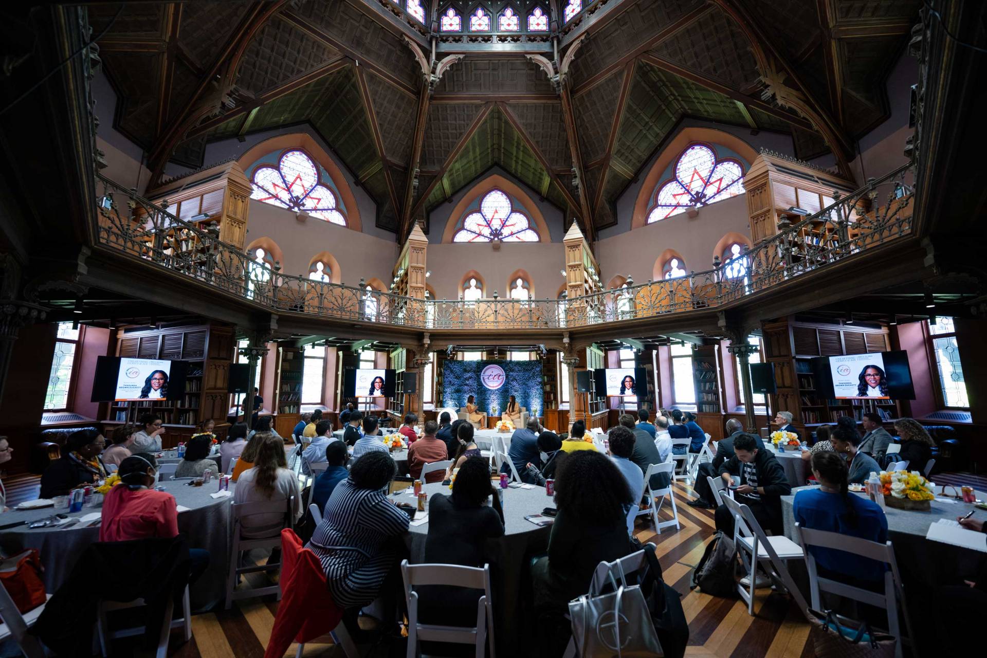 People attend the symposium in Cannon Green