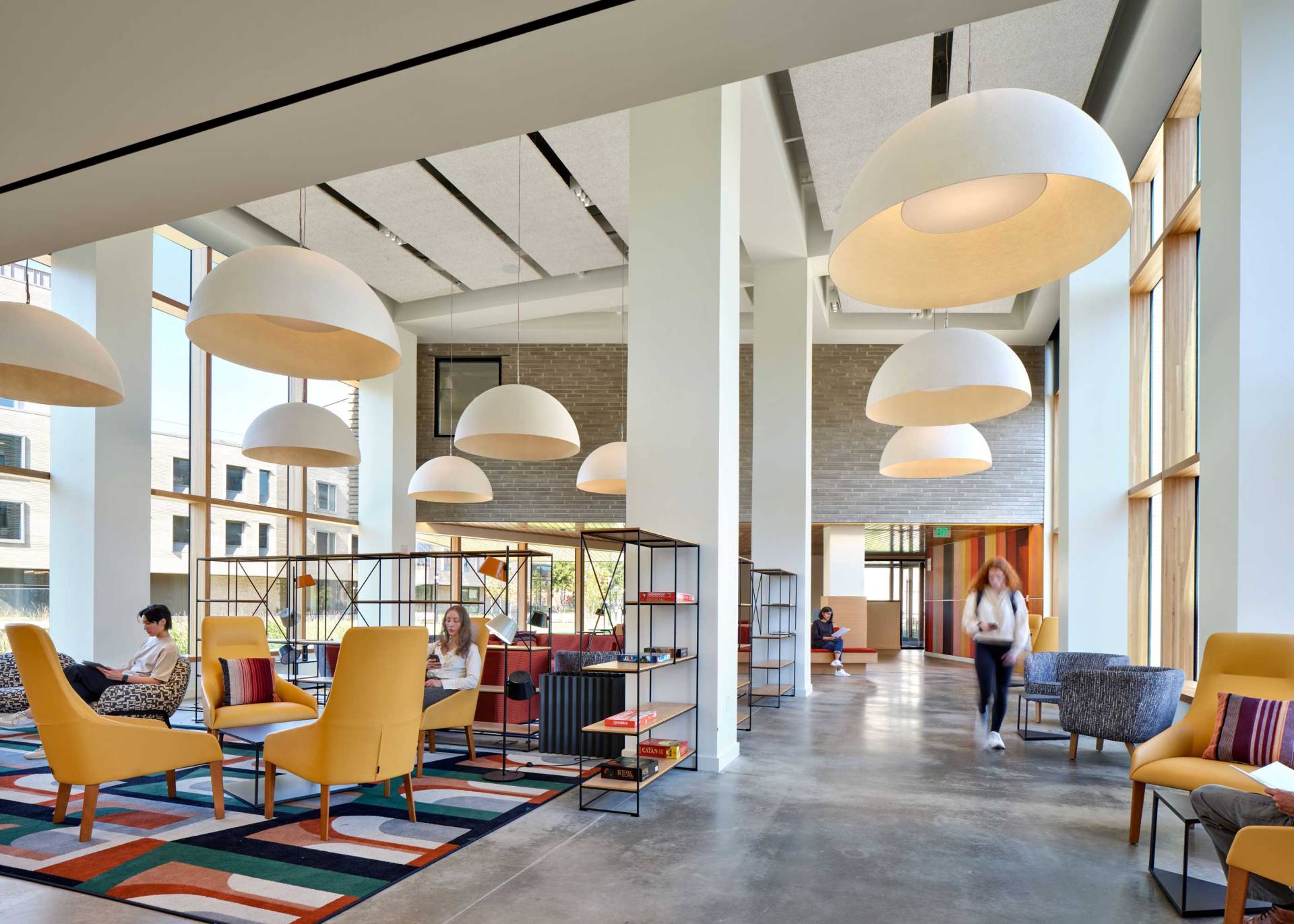 Open common area filled with colorful modern furnishings