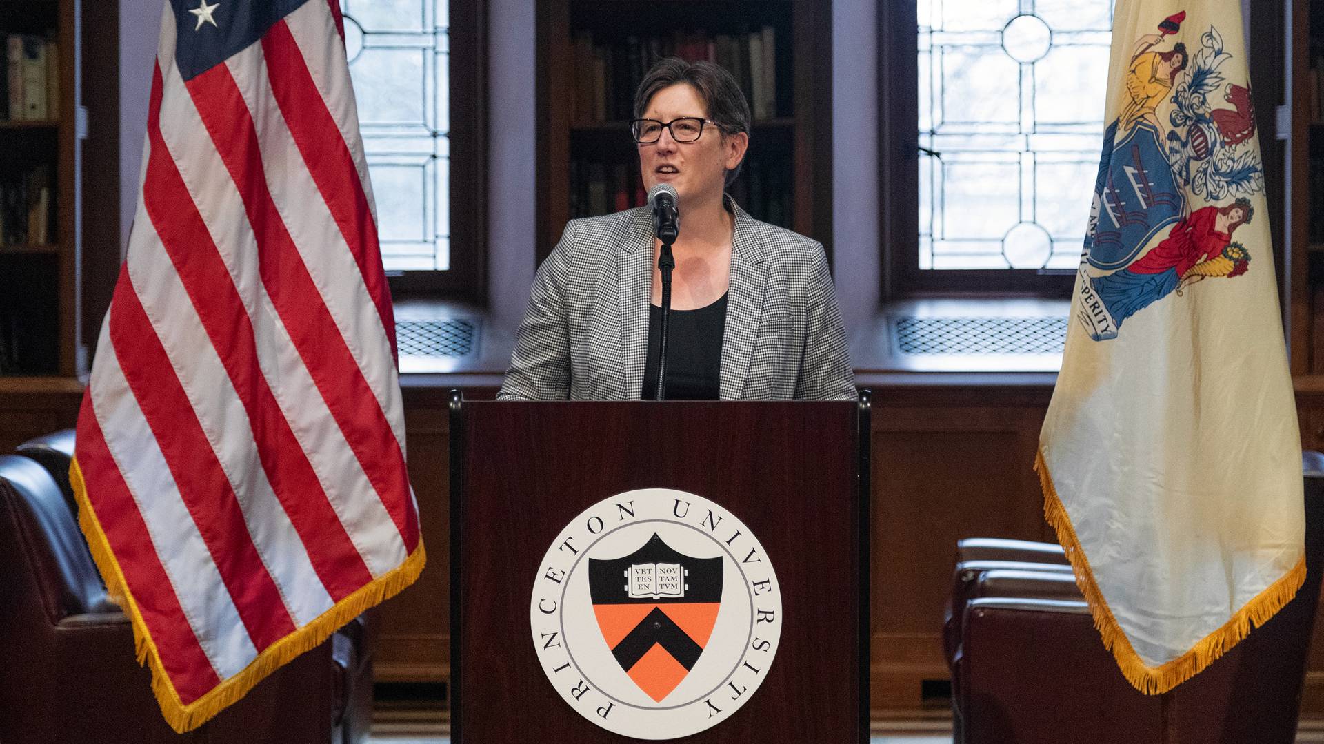 Jen Rexford speaking at a podium in the Chancellor Green Library in front of a large audience