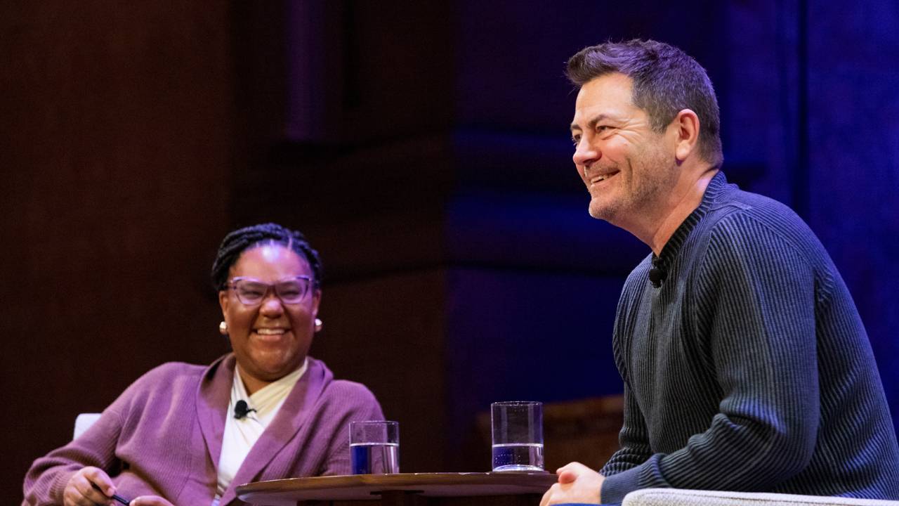 Emmy-award winning actor, comedian, writer and producer Nick Offerman (right) shares a laugh with Mell Thompson (left), associate dean of undergraduate students, during the "Beyond the Resume" conversation in Richardson Auditorium on Jan. 26.&nbsp;