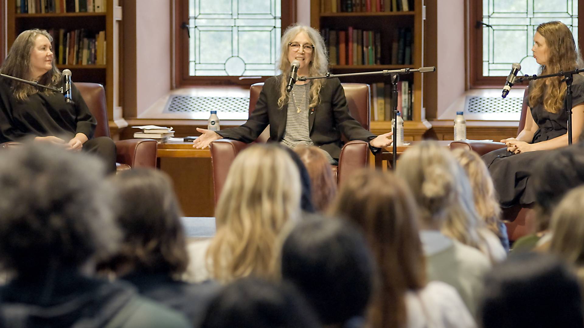 Patti Smith (center) takes part in a public conversation with Bridget Doherty, associate professor of German and art and archaeology (left), and Hope Litwin