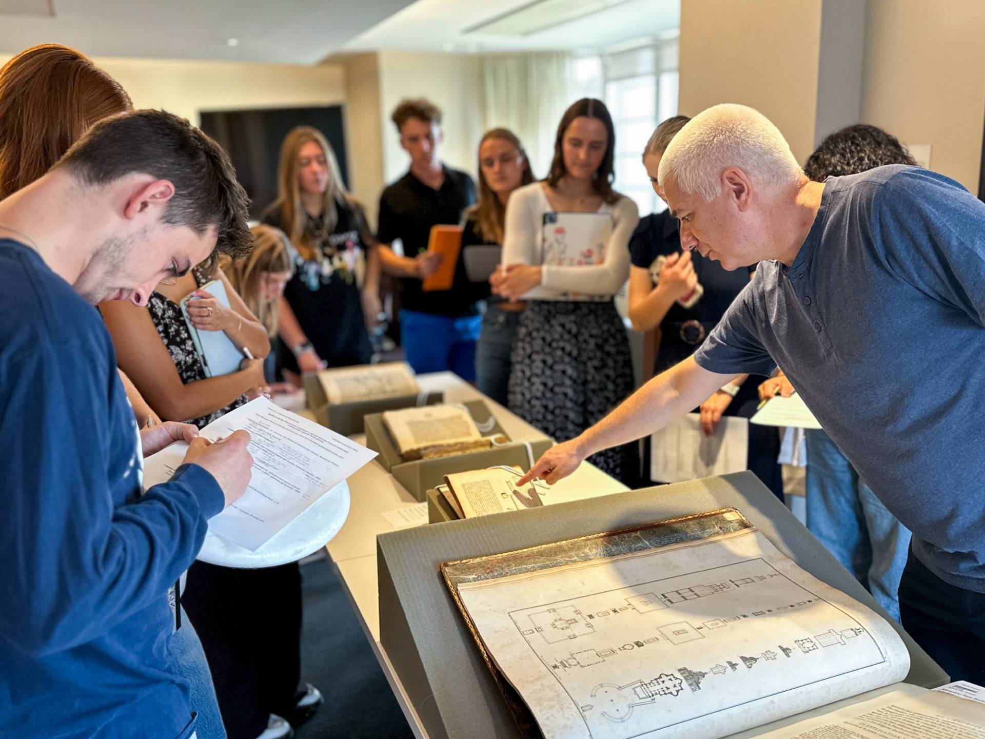 Students studying old documents