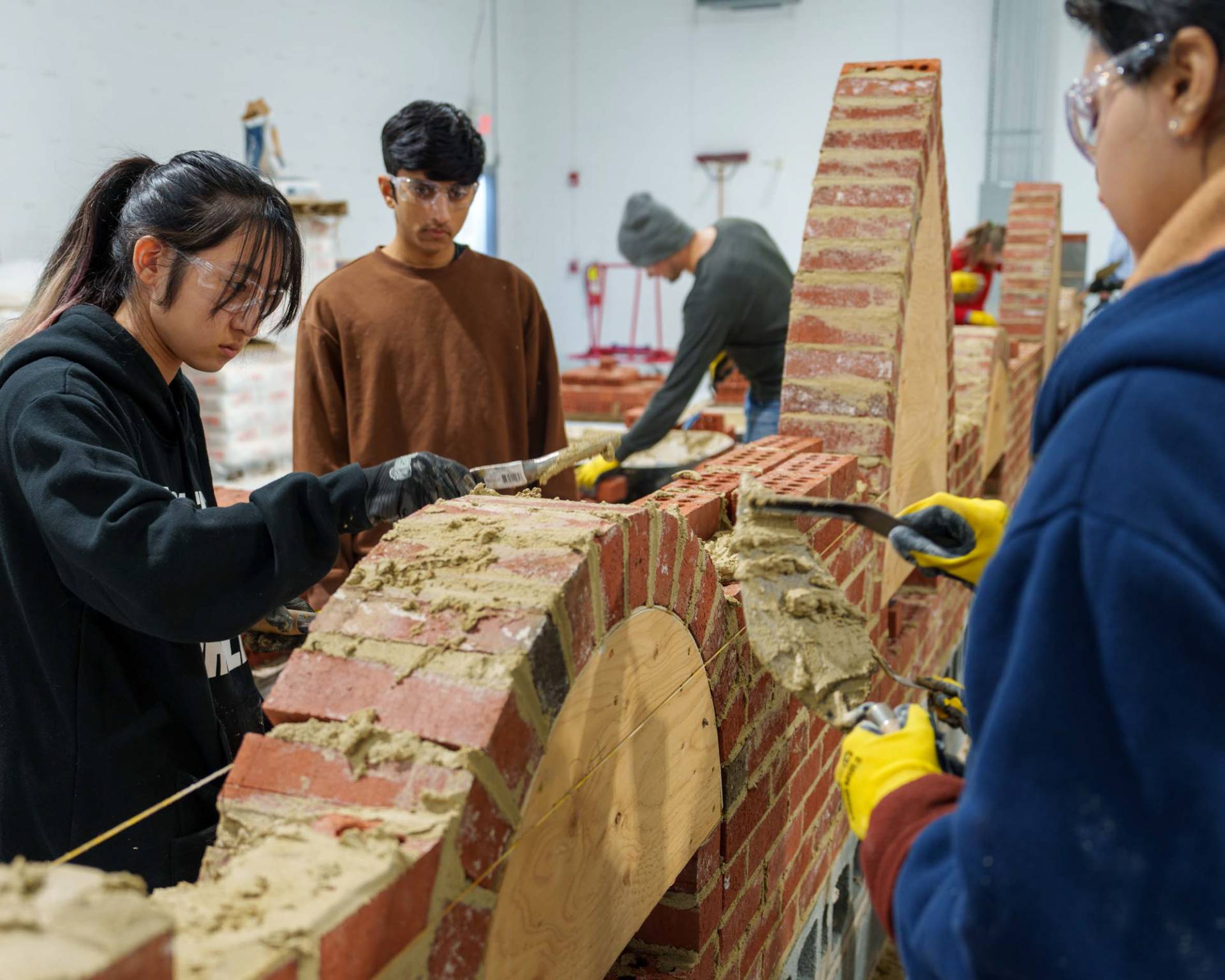 Students laying bricks