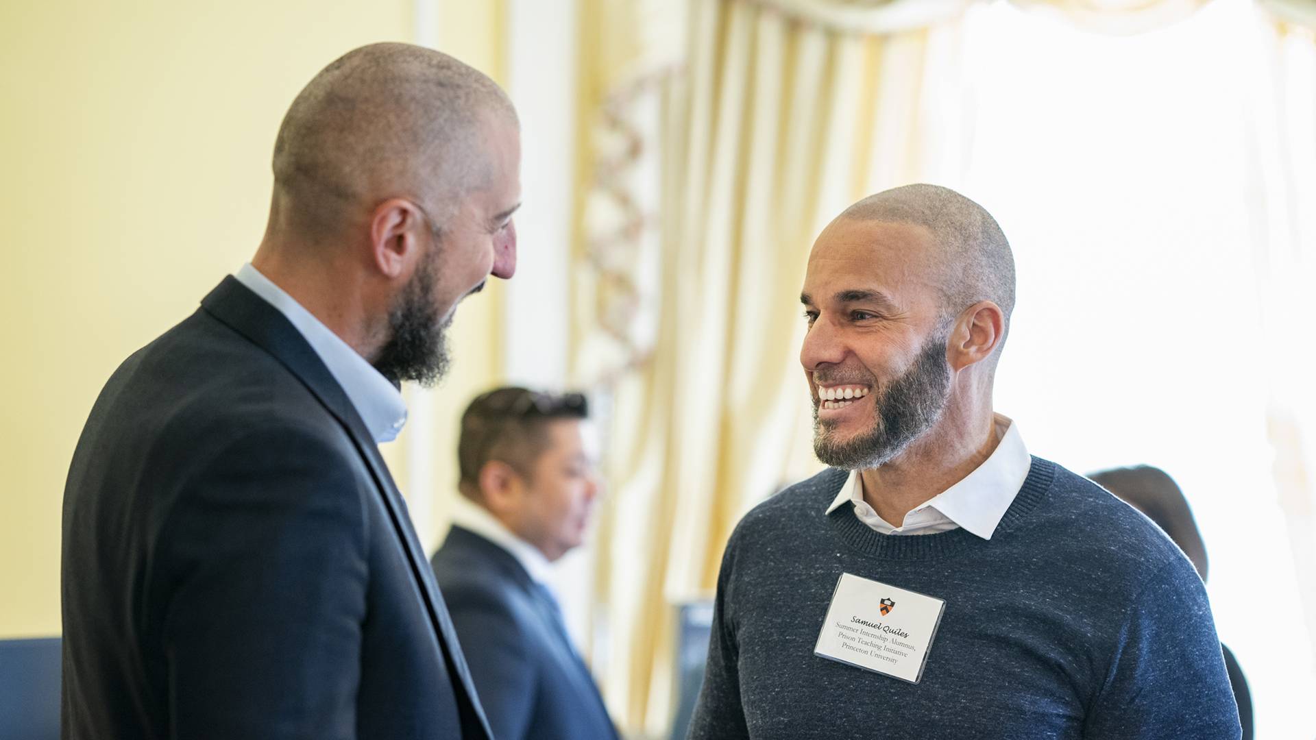 Christopher Agans and Samuel Quiles conversing 