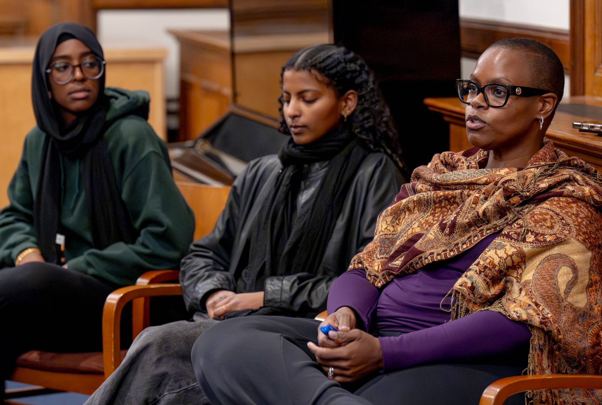 Princeton students Alaa Omer and Rahma Elsheikh seated with Dean of Religious Life Theresa S. Thames