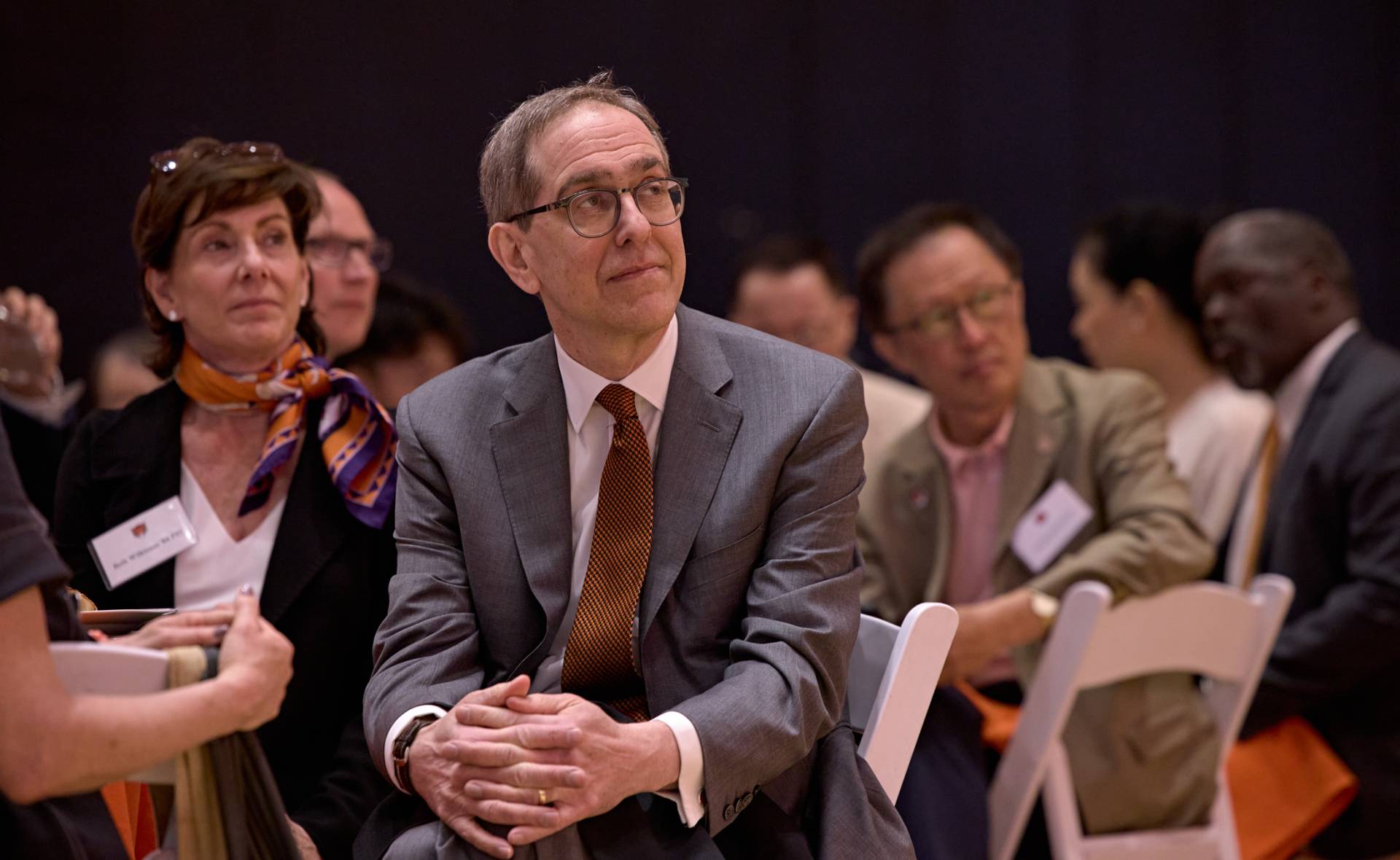 President Christopher L. Eisgruber listens attentively to fellow speakers at the dedication luncheon.