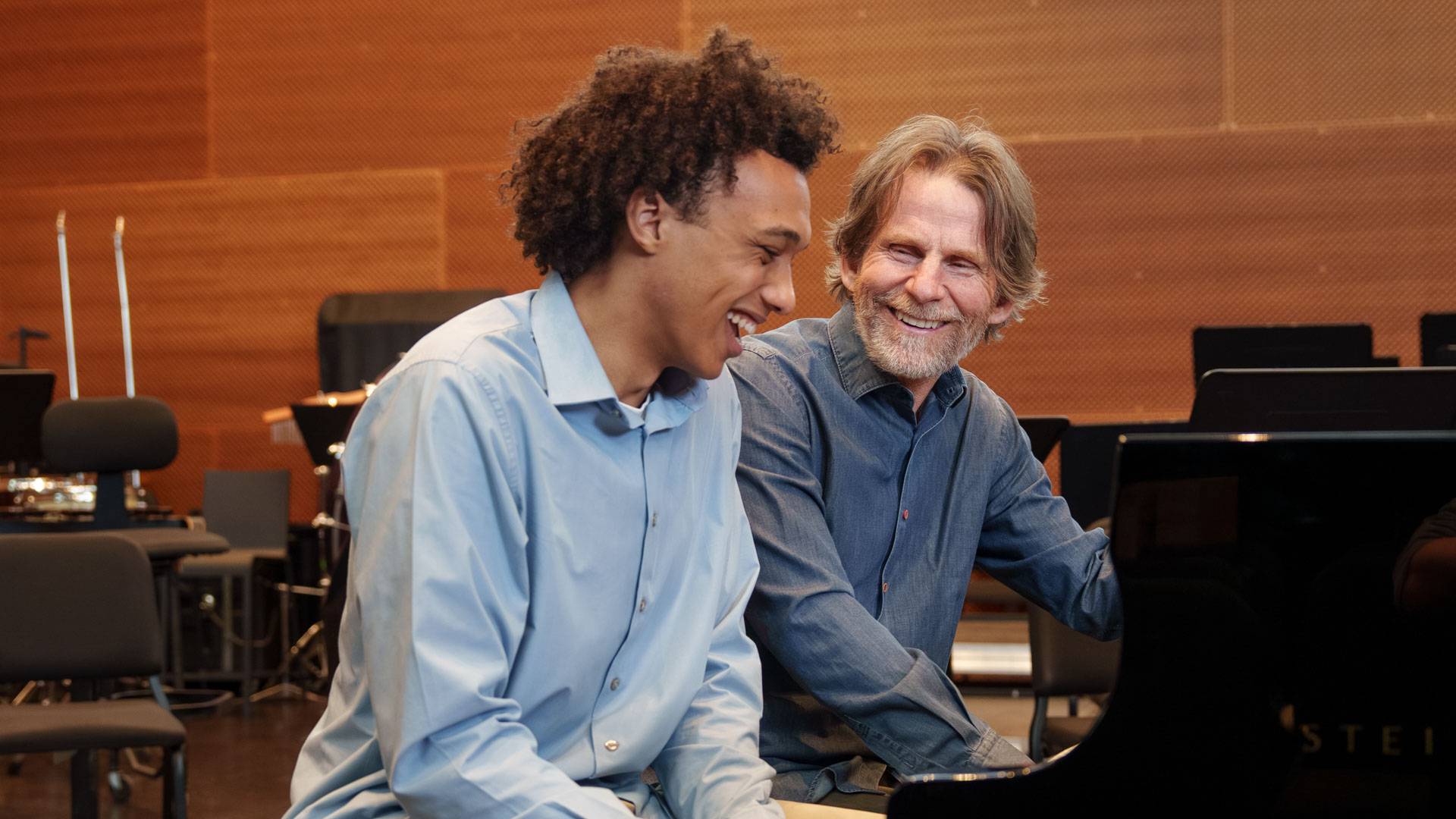 Toussaint Santicola Jones at the piano with his thesis adviser, Steve Mackey.