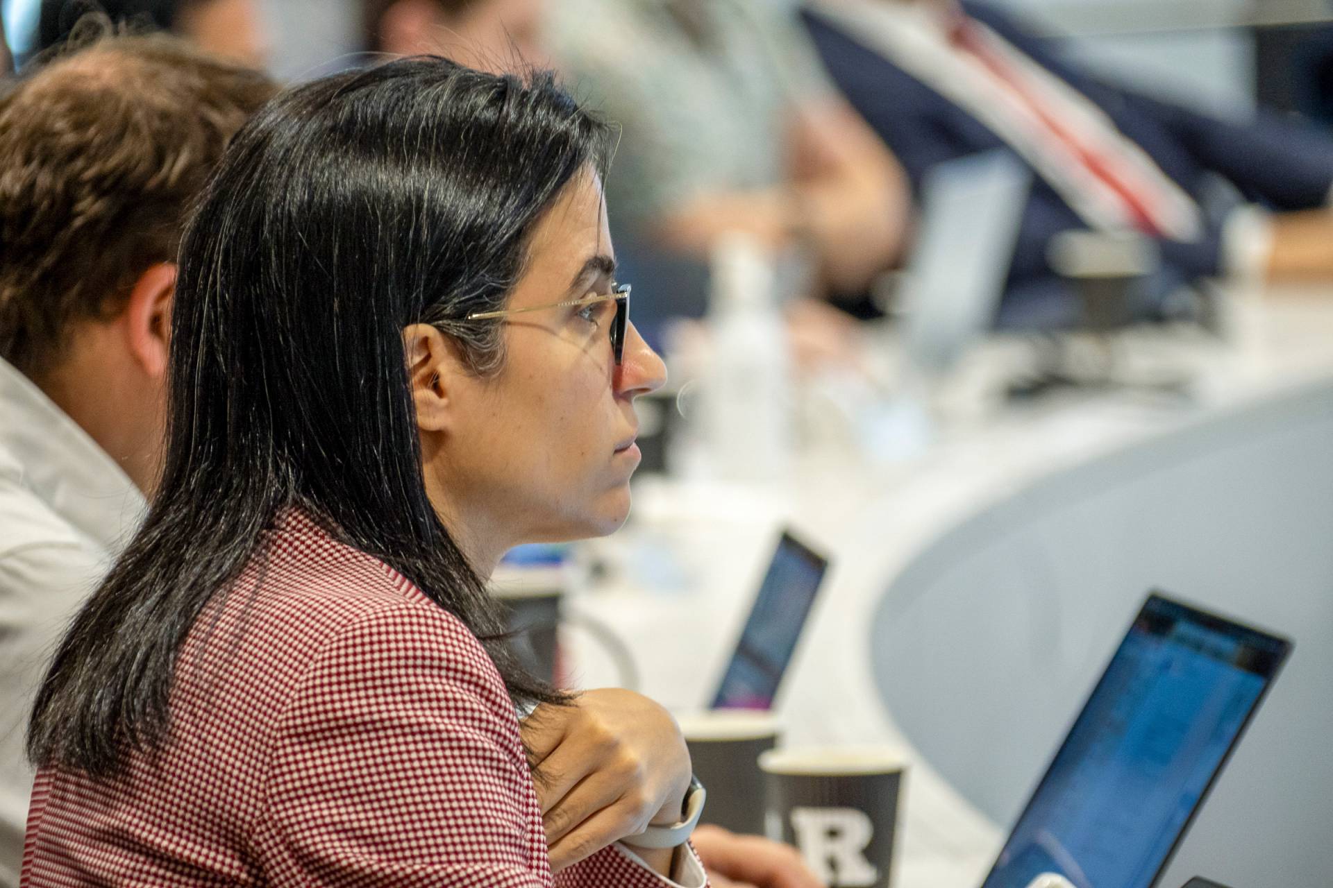 Summit organizer Chantal Badre listens from the audience.