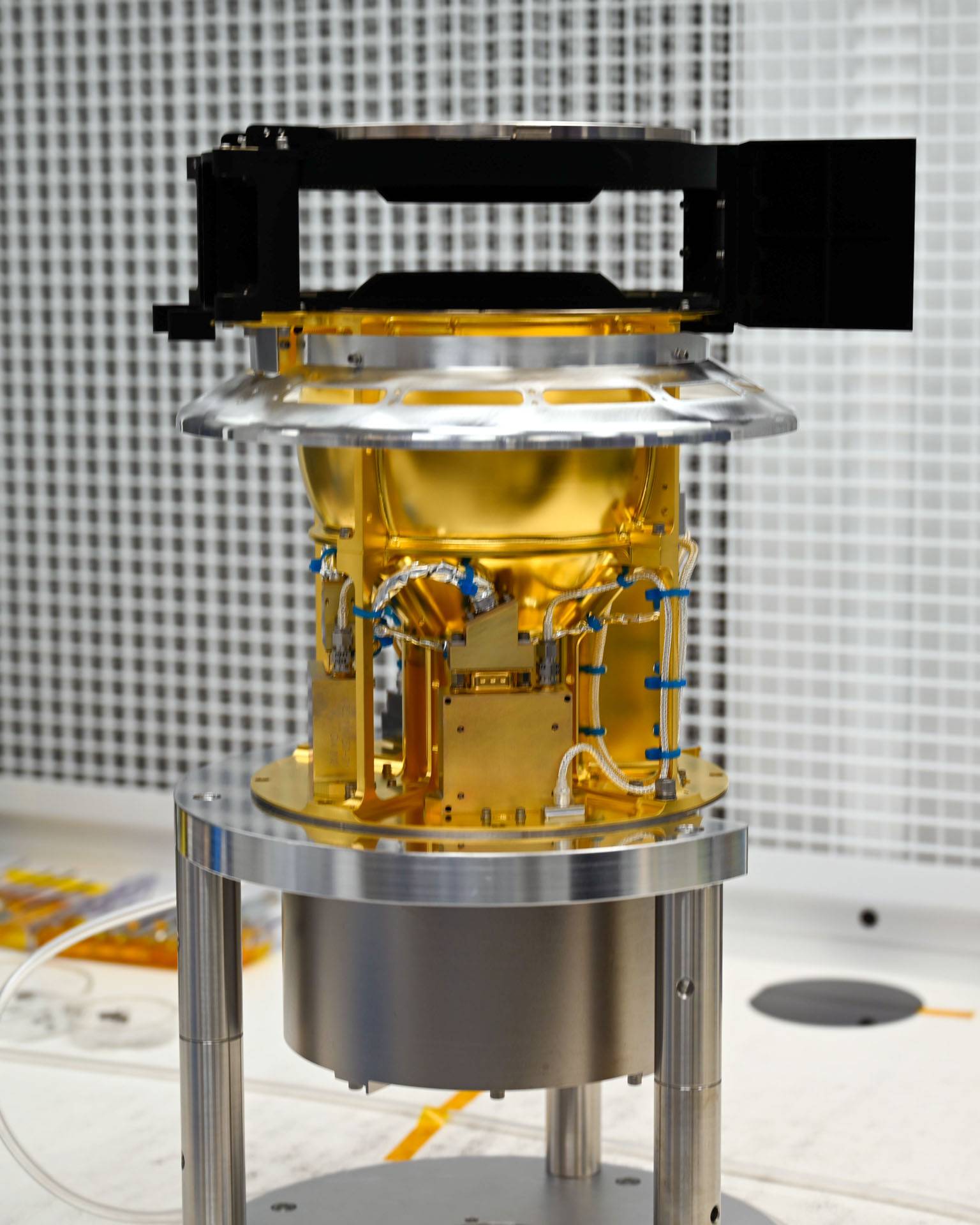 SWAPI is a shiny golden instrument shaped roughly like a coffee pot.