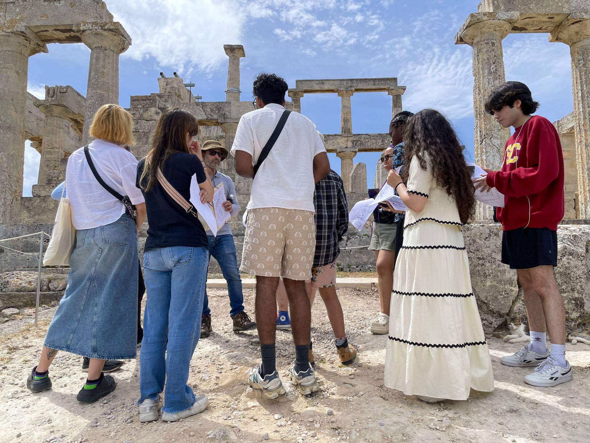 Students learn about the Temple of Aphaia (c. 500 BCE) on the island of Aegina.
