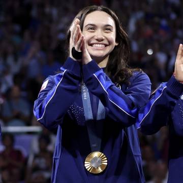 Maia Weintraub wearing a gold medal
