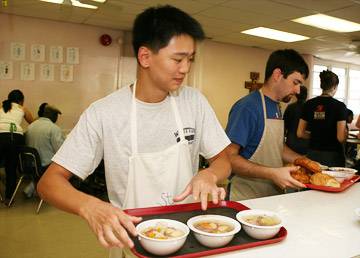 Serving dinner at the soup kitchen