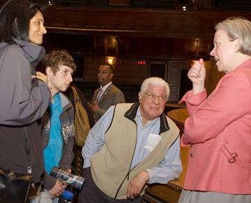 attendees discussing talk with Tilghman