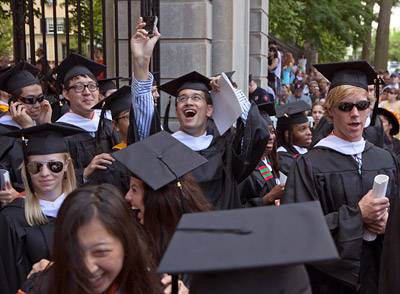 Graduates recessing through gate