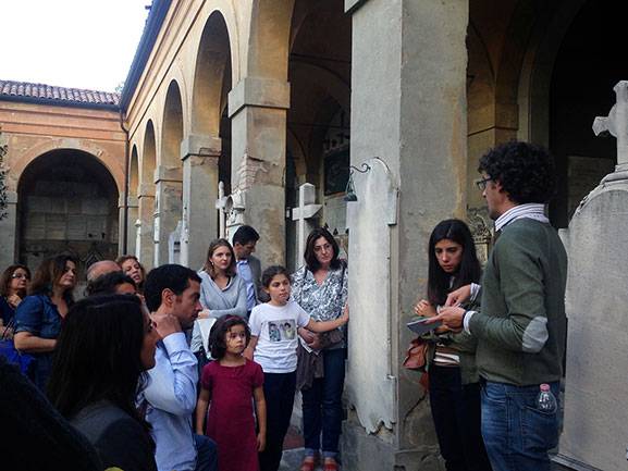 Enrico Sassoni, a visiting postdoctoral research associates in Princeton's Department of Civil and Environmental Engineering, is working to preserve monuments, like those at Italy's Certosa di Bologna cemetery, from environmental degradation. Above, Sossoni, right, leads a tour of the cemetery. 
