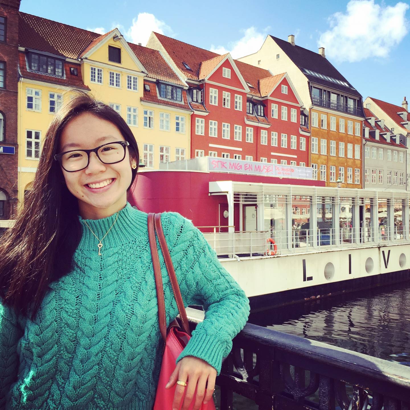 Portrait of Jin Yun Chow posting on a bridge.