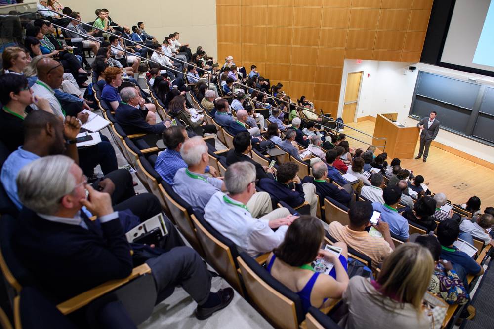 Audience looks on as one of the teams describes their startup idea at the Demo Day presentation