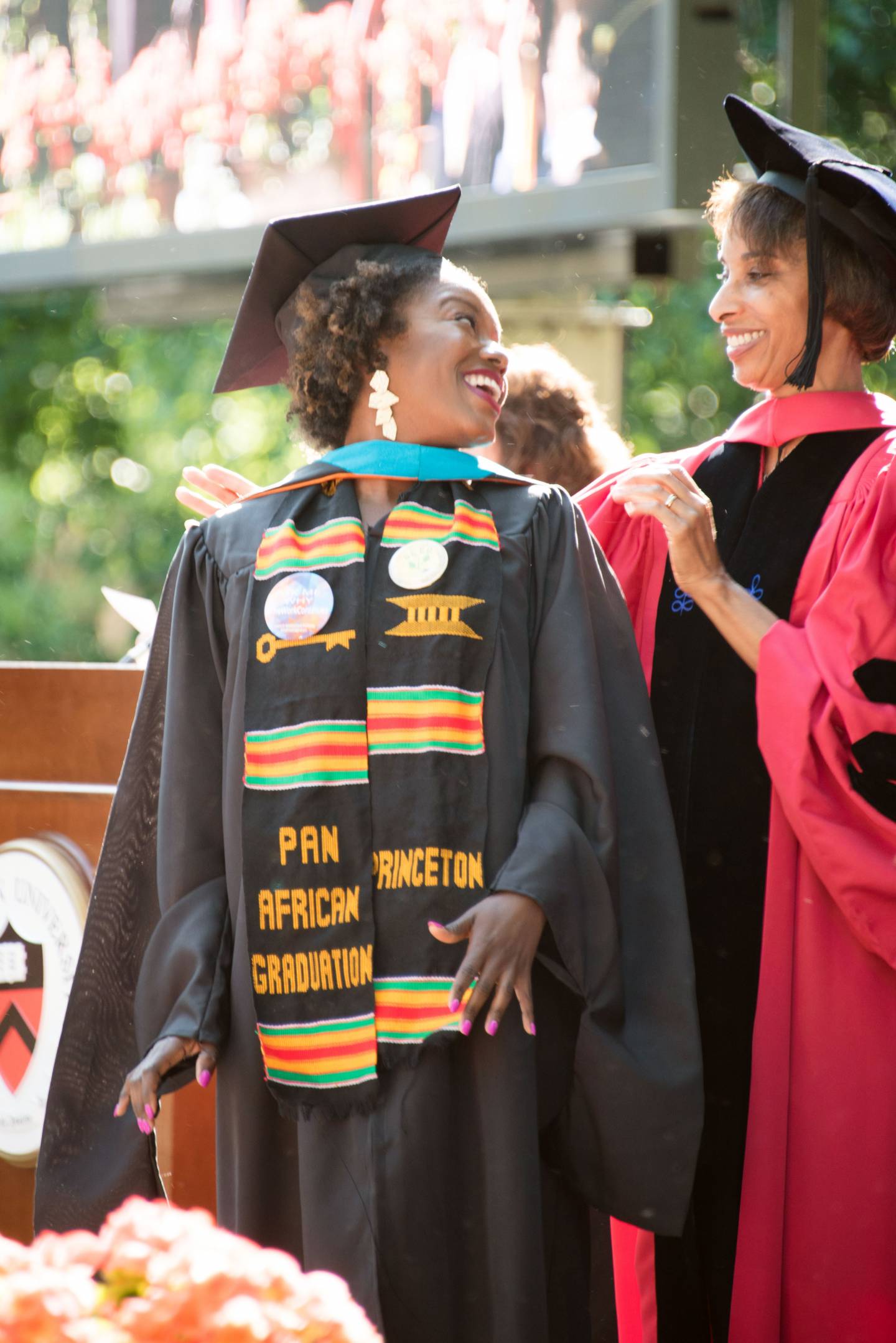Kayla Iman Vincent receiving her hood from Dean Rouse