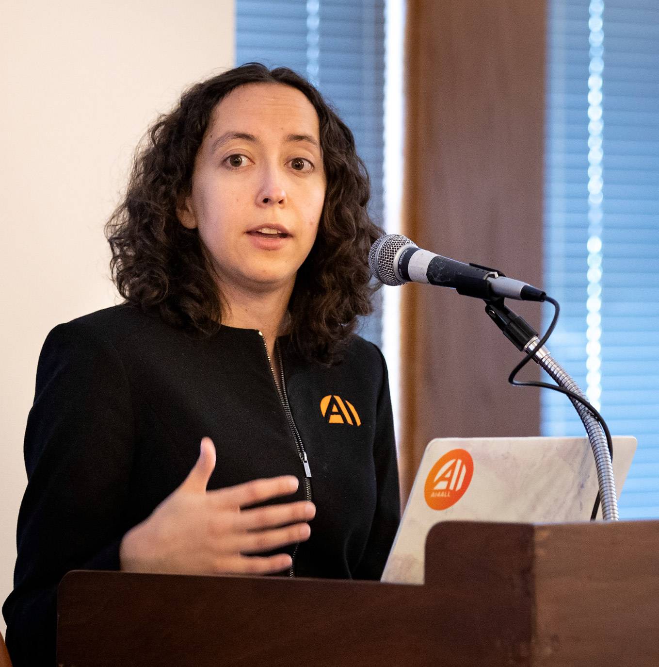 Professor Olga Russakovsky speaking at the podium