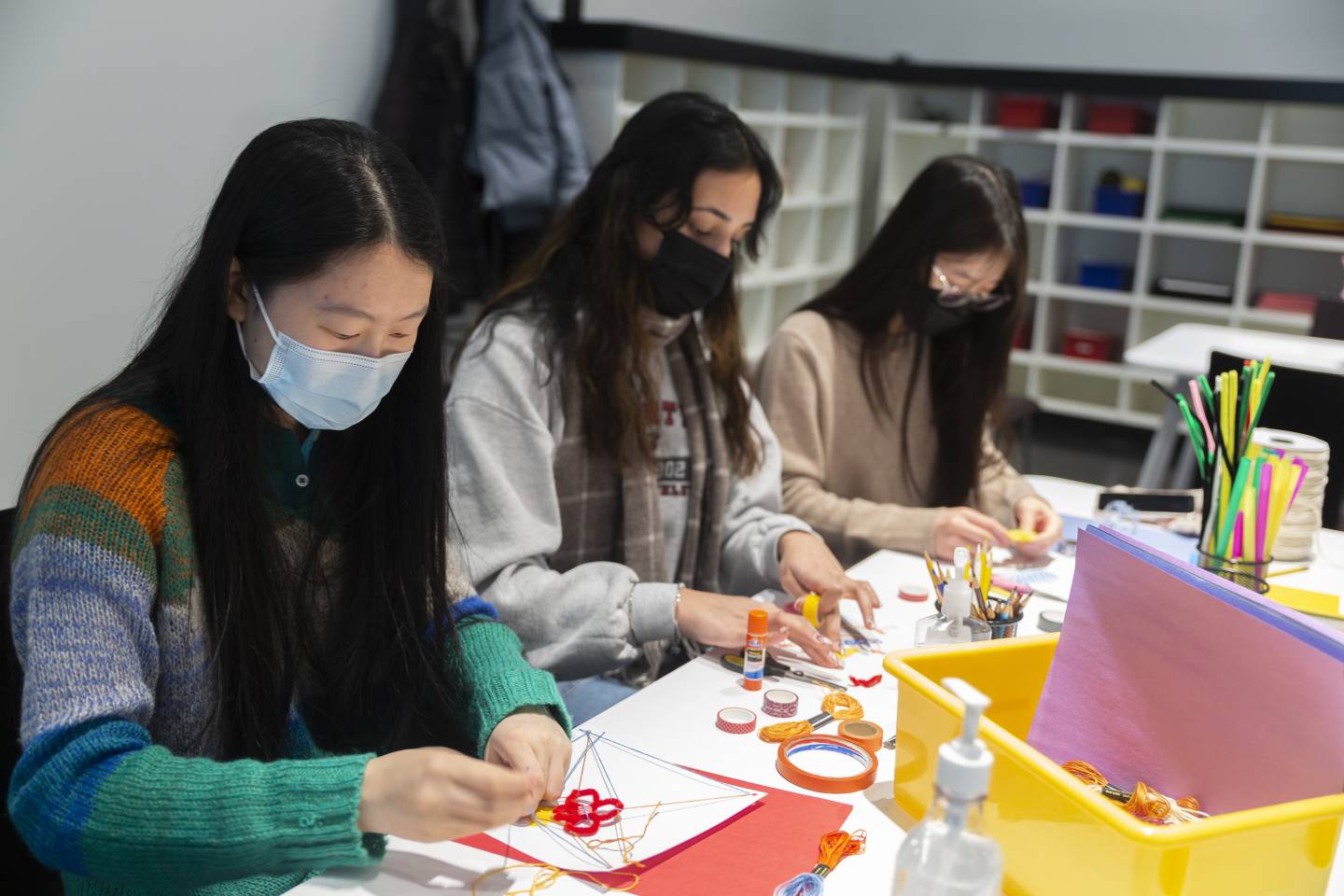 Visitors making art at Art on Hulfish gallery