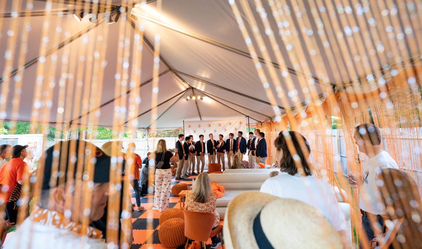 An a capella group singing for the Class of 1987
