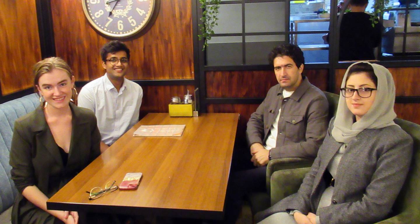 Two Princeton students with two Afghan refugees