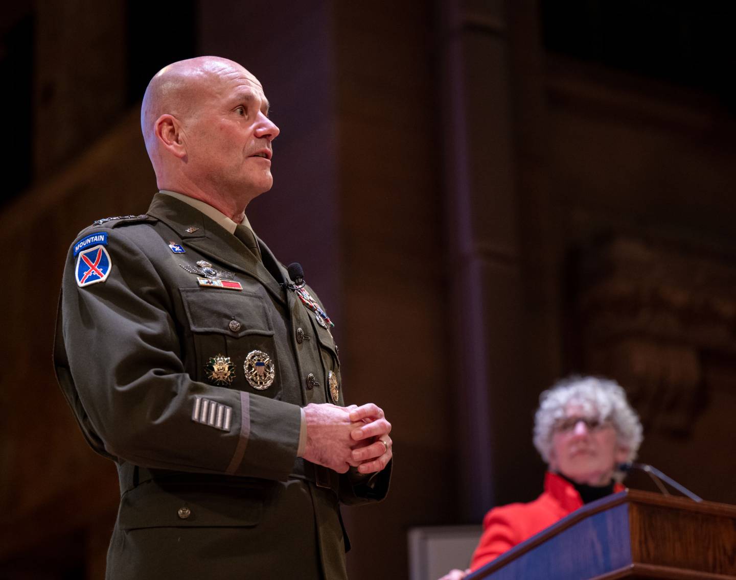 Cavoli stands on stage with Jill Dolan