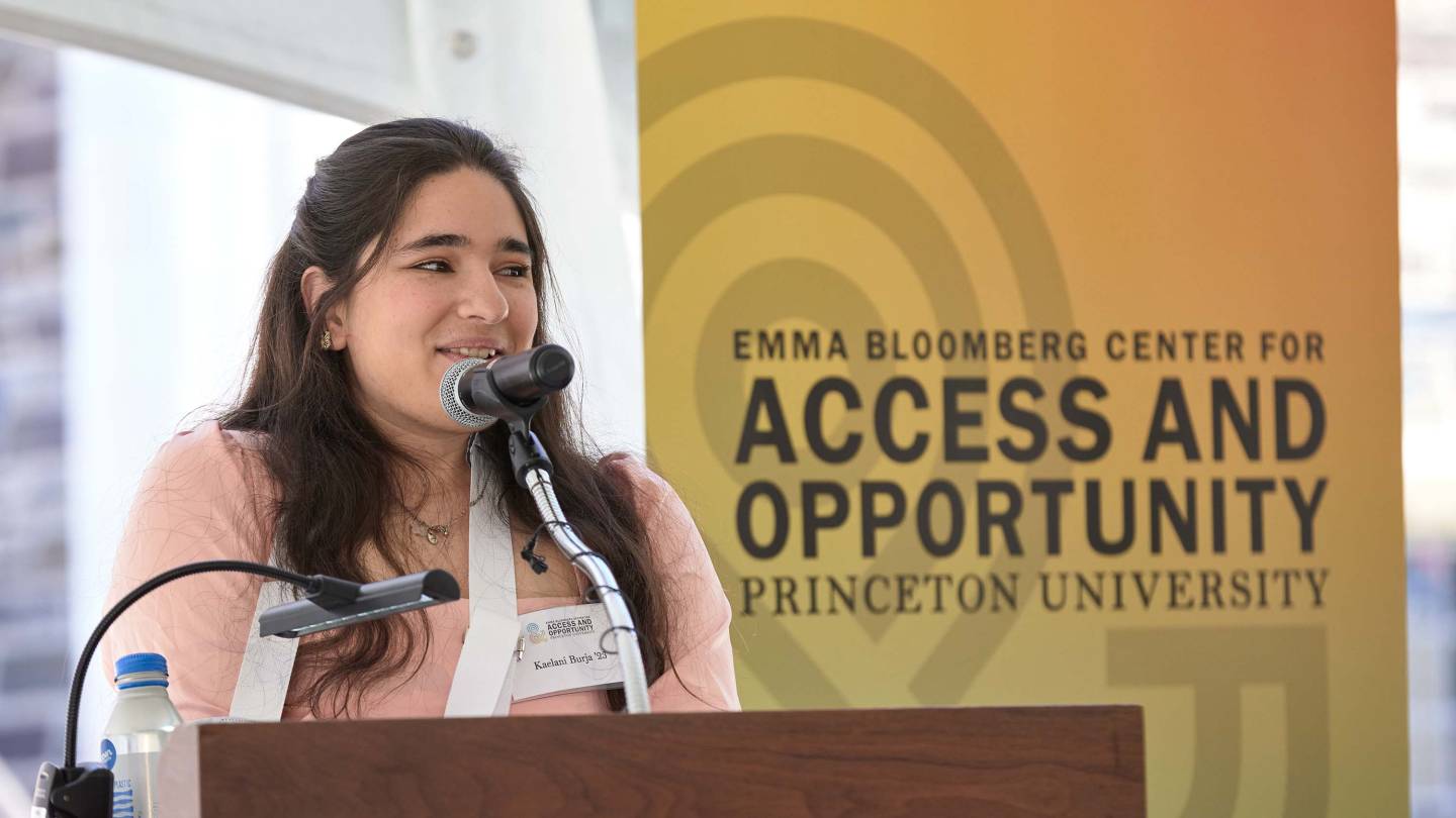 Kaelani Burja speaking at the podium.