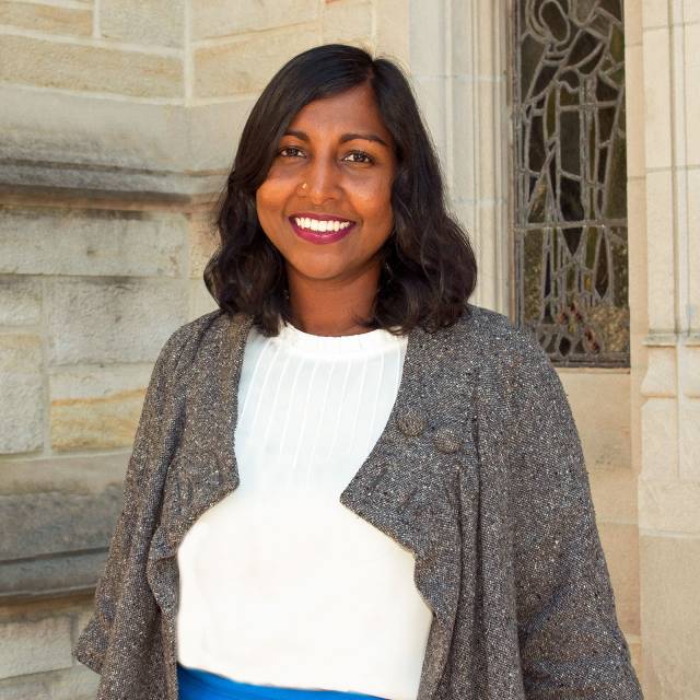 Anna Arabindan-Kesson standing outside chapel