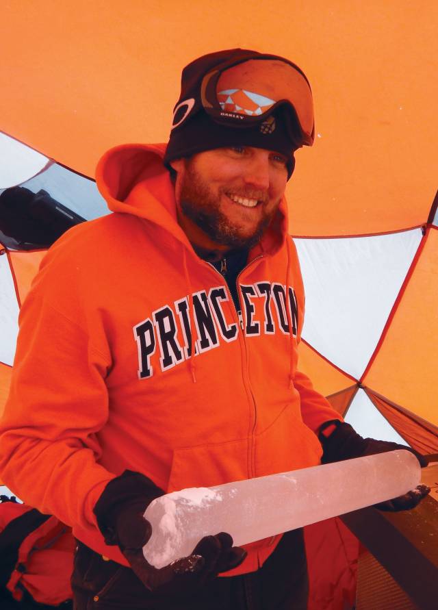 John Higgins holds an ice sample