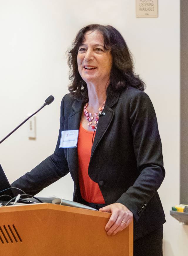 Andrea Goldsmith at the podium